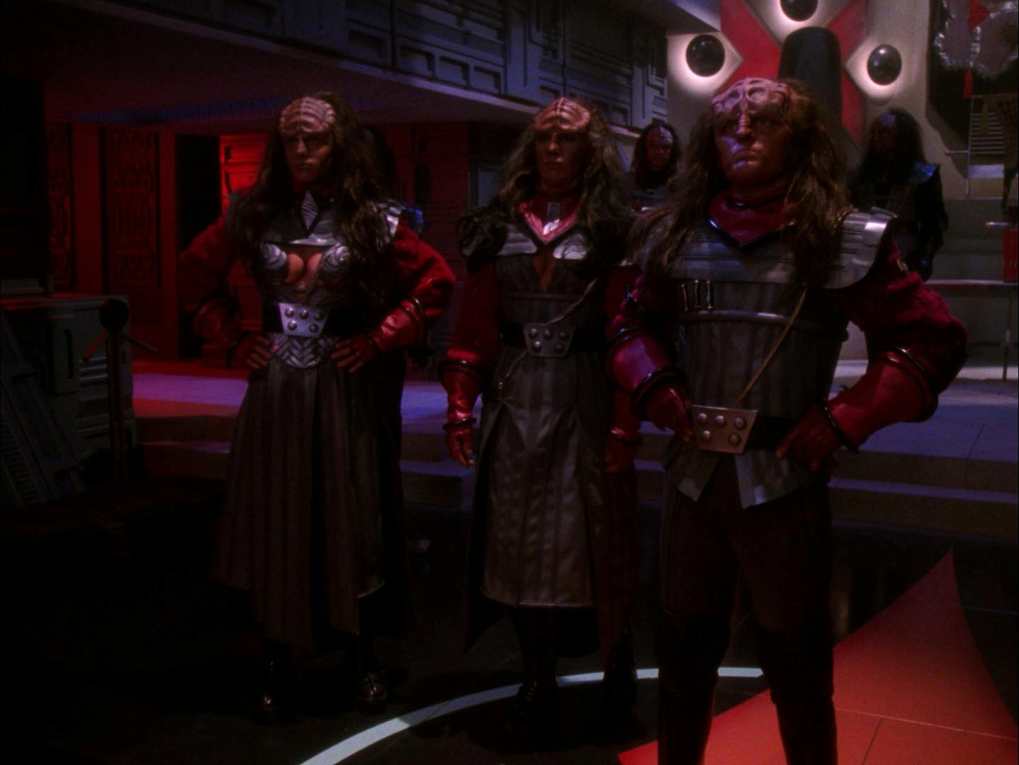 The Duras faction Lursa, B'Etor, and Toral stand proudly in front of the Klingon High Council in 'Redemption'