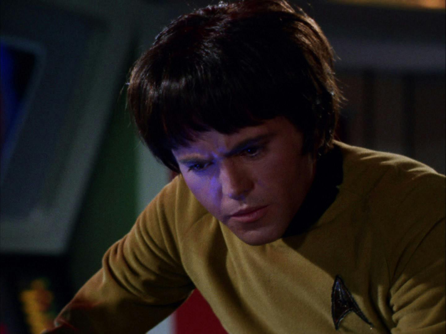 Close-up of Chekov looking down at the monitor at his station in 'Catspaw'