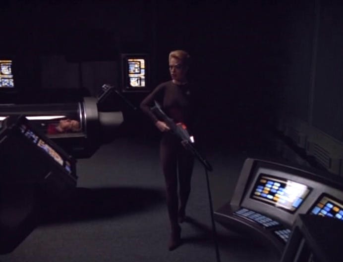 Seven of Nine approaches a console while the Voyager crew are in hypersleep in 'One'