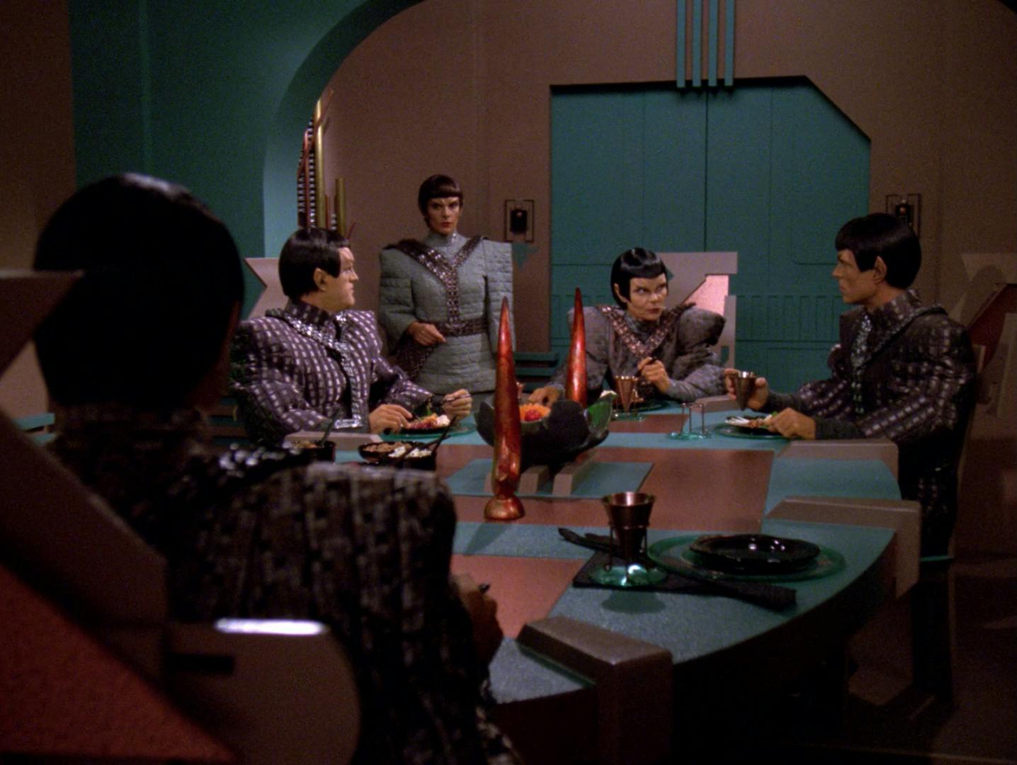 Deanna Troi posing as Major Rakal joins others aboard the Romulan warbird Khazara for dinner in 'Face of the Enemy'