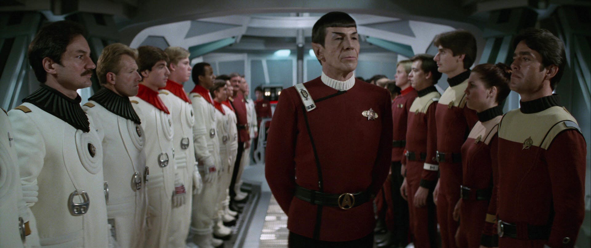 Spock walks down the corridor lined up by cadets on both sides following the Kobayashi Maru simulation in Star Trek II: The Wrath of Khan