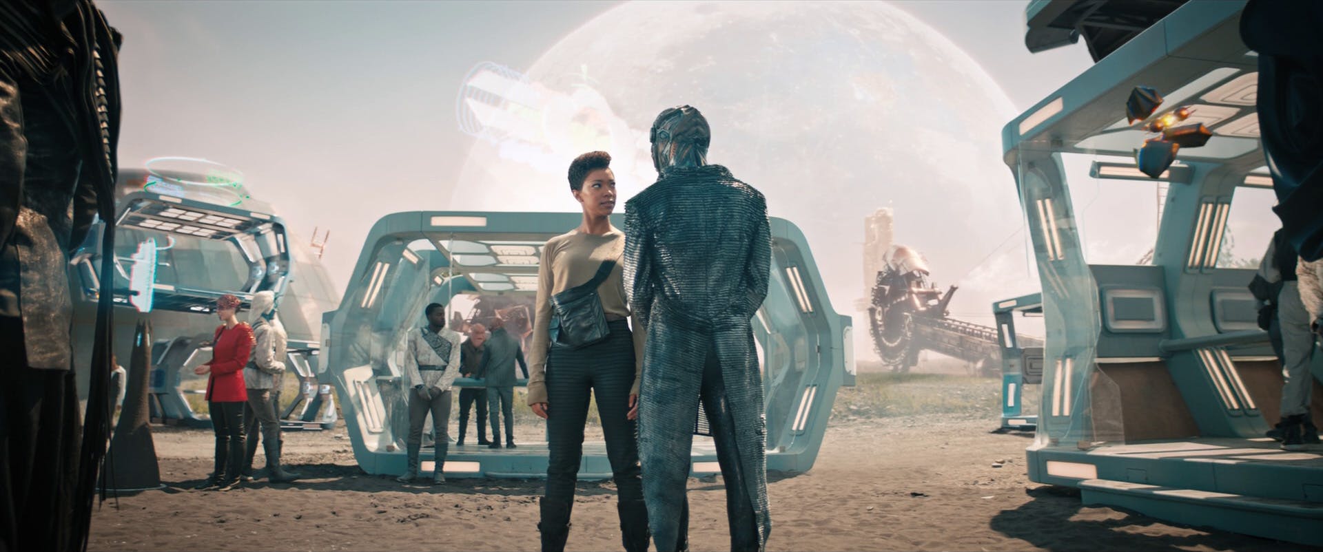 Michael Burnham, during her year as a courier away from Discovery, arrives at a mercantile exchange searching for clues in 'People of Earth'