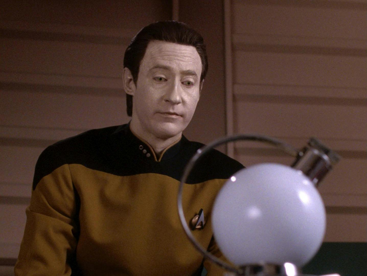 In his quarters, Data sits in front of his experiment in 'Timescape'