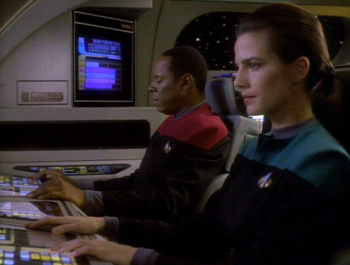 Jadzia Dax sits in a shuttle besides Benjamin Sisko in 'Emissary'