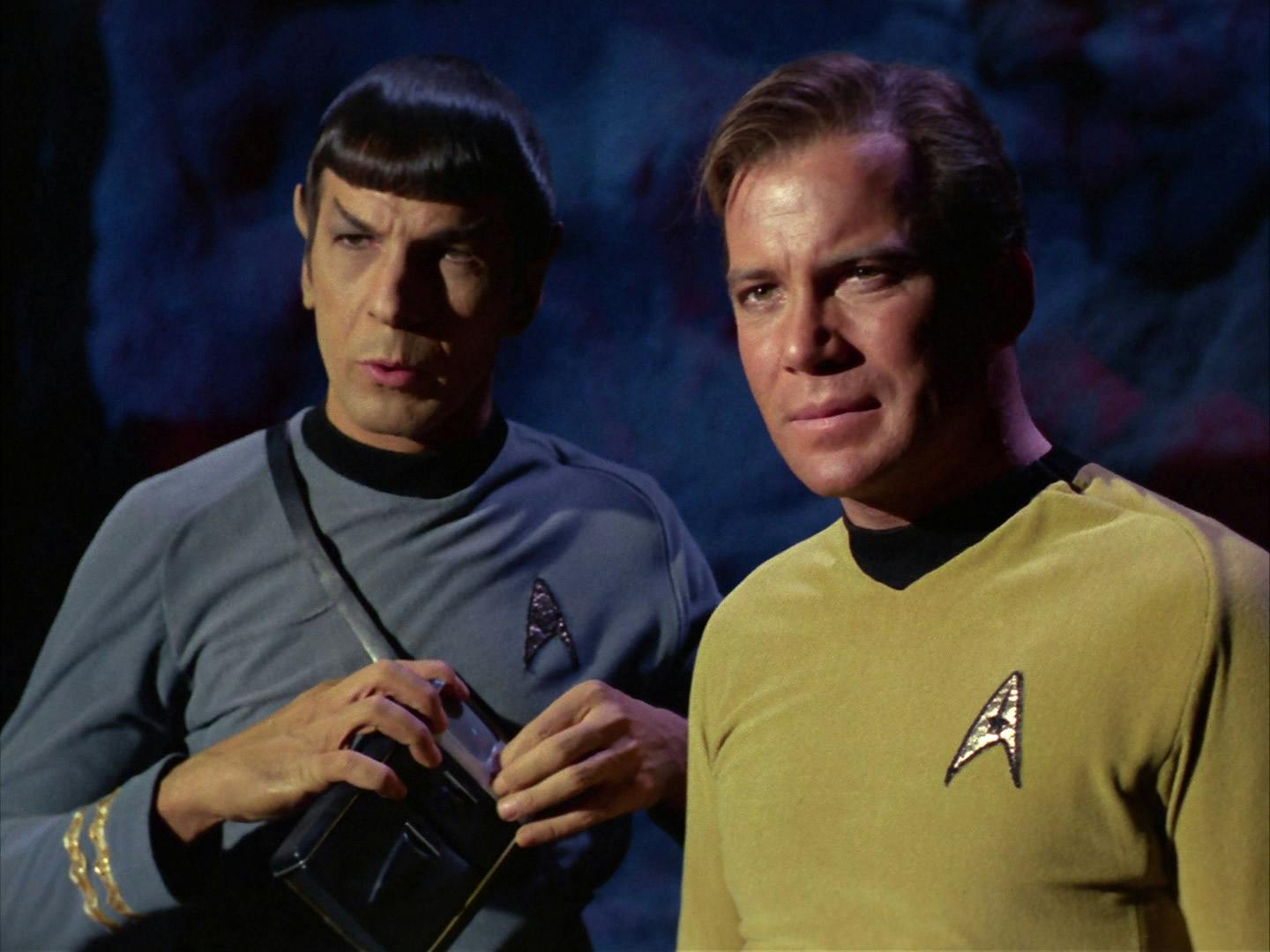 Spock prepares his tricorder for a scan as he stands besides Captain Kirk in 'The City on the Edge of Forever'