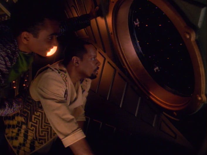 Ben and Jake Sisko feel the spirit of exploration as they gaze out of the window of their lightship in 'Explorers'