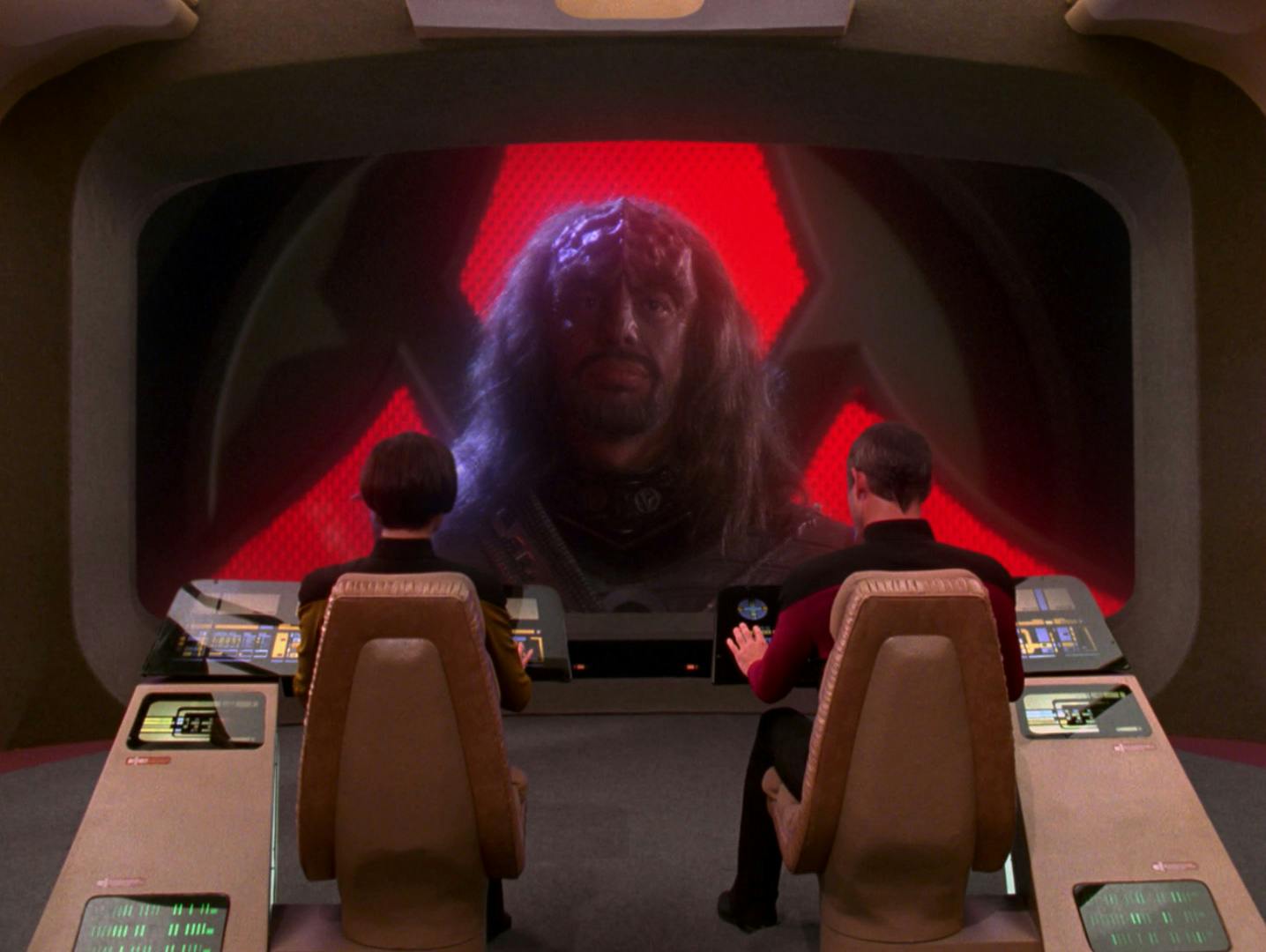 The Junior Adjutant to the Klingon Diplomatic Delegation appears on the Enterprise-D bridge viewscreen in 'Unification, Part I'