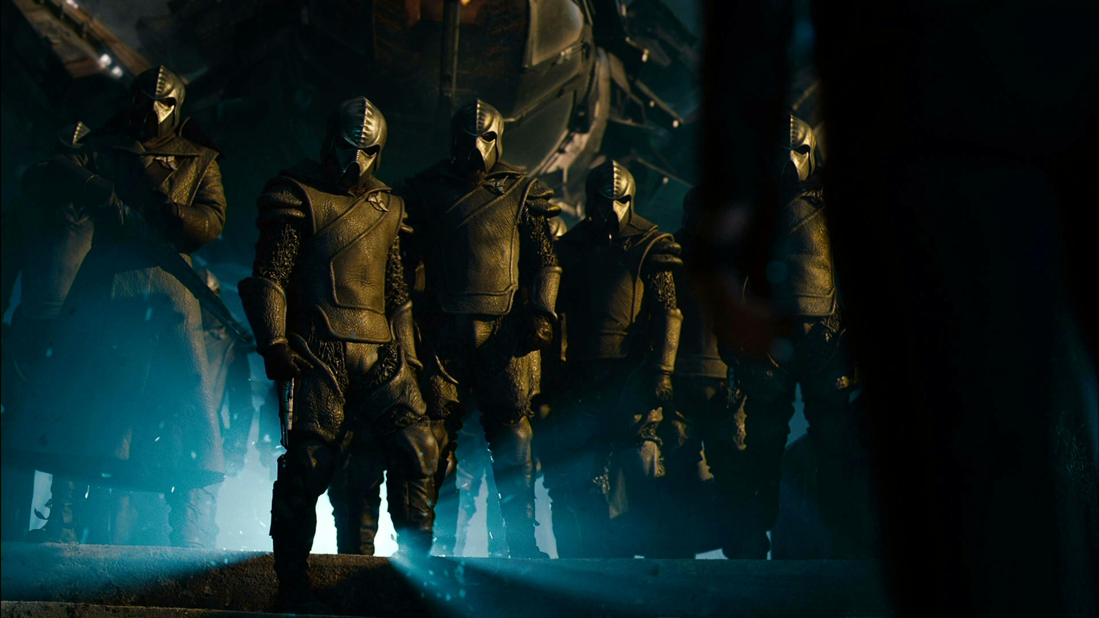 Uhura is greeted by a group of masked Klingon warriors in Star Trek Into Darkness