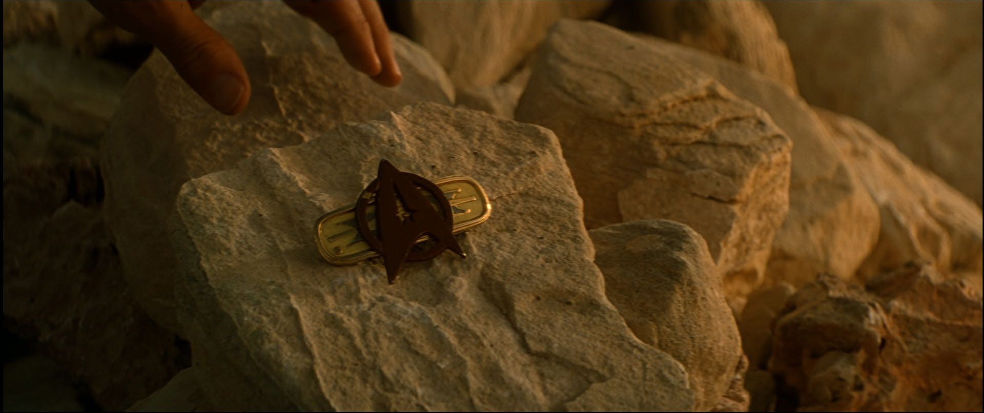 Jean-Luc Picard places Kirk's badge on his makeshift final resting place in 'Star Trek Generations'