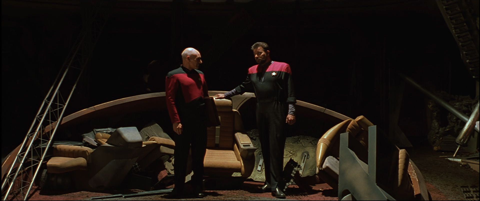 Picard and Riker stand among the wreckage of the Enterprise-D bridge in 'Star Trek Generations'