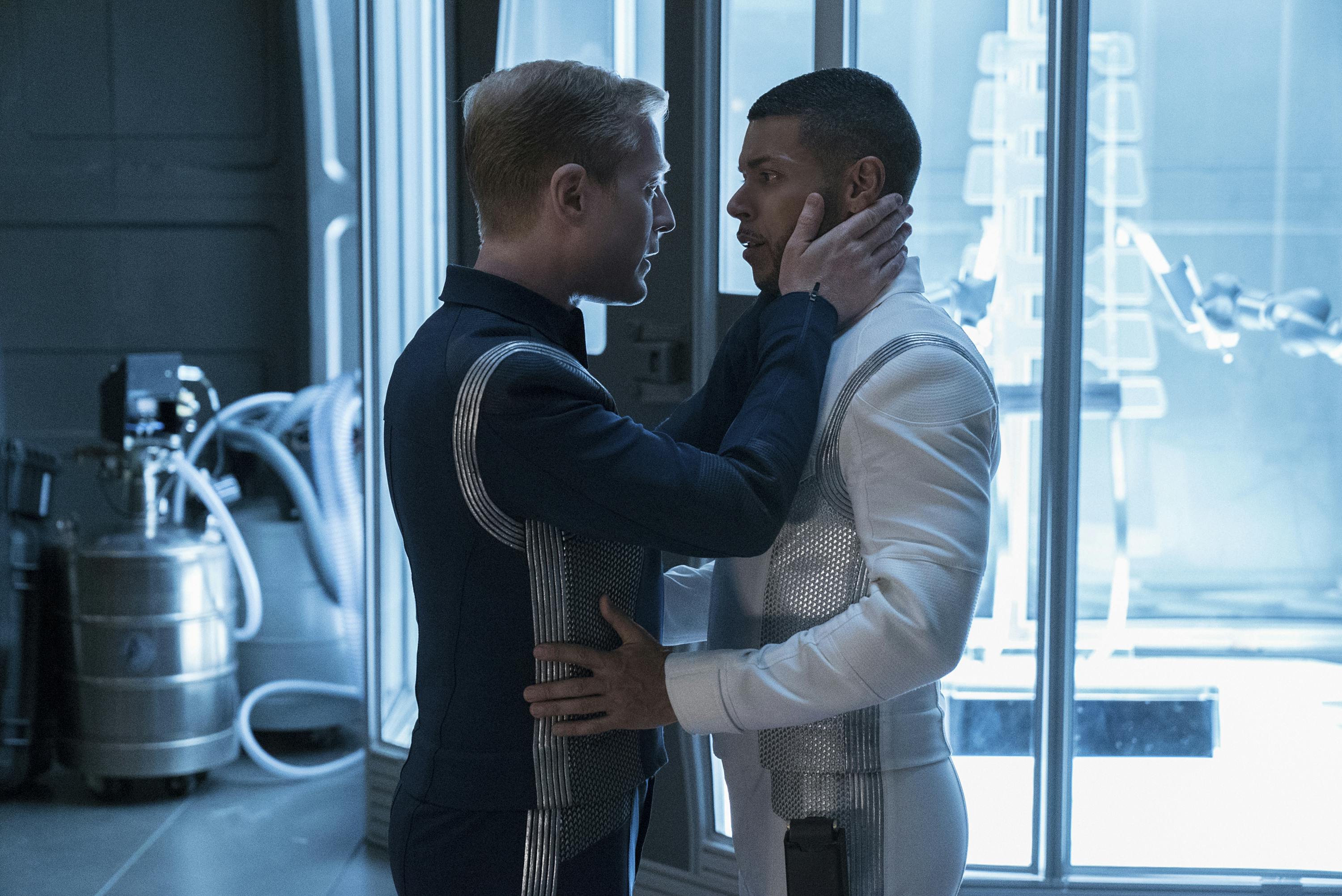 In a tender moment, Culber grabs Paul's waist as Stamets looks into Hugh's eyes while cupping his face in his hands in 'Into the Forest I Go'