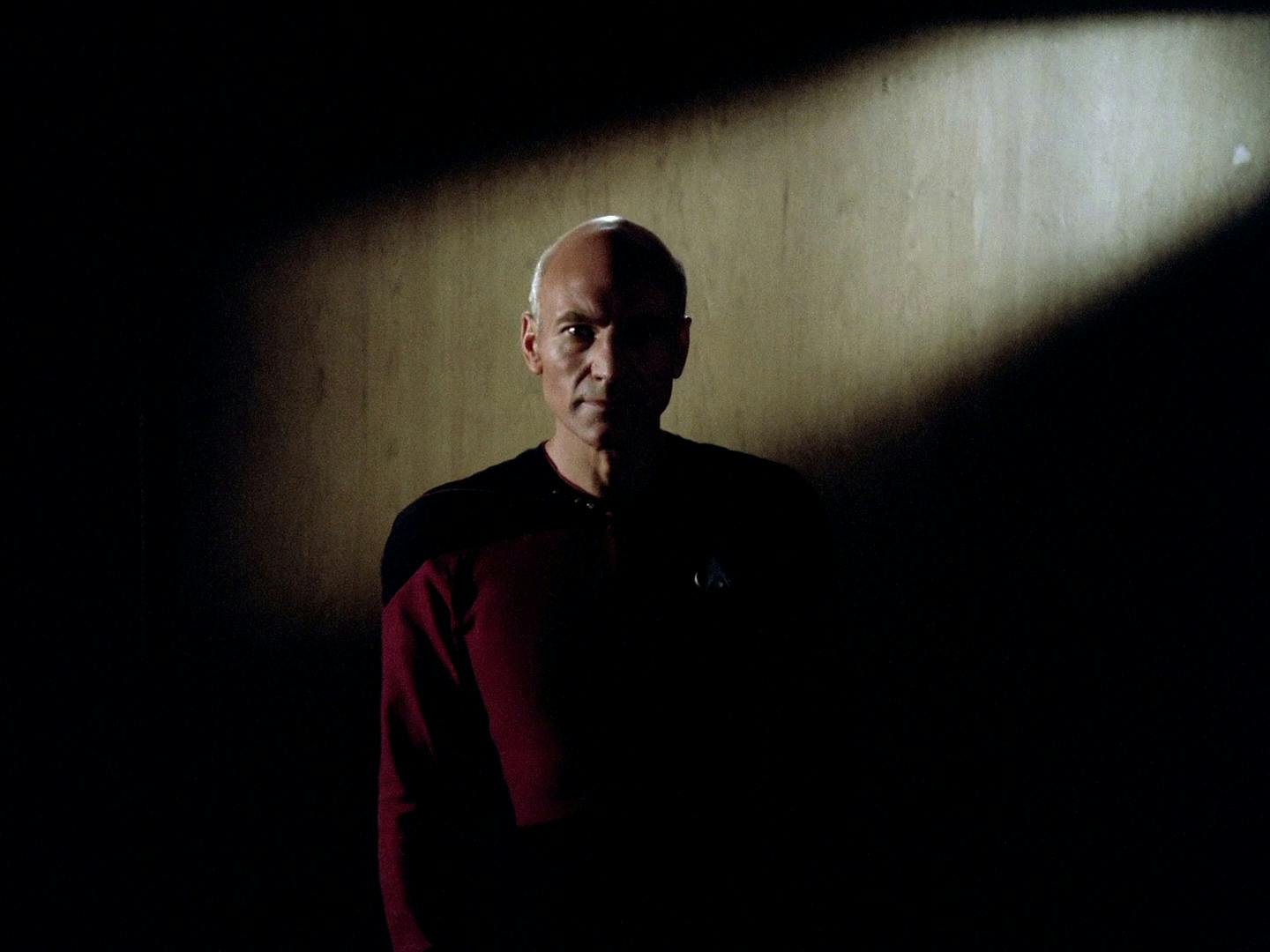 Emerging from the shadows, Captain Picard looks out at the 'great, unexplored mass of the galaxy' in the opening of 'Encounter at Farpoint'