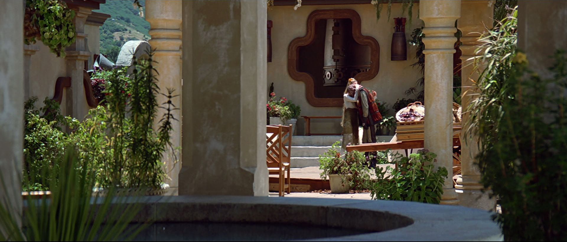 Sojef, Anji, and Picard witness a regretful Gallatin embracing his mother in Star Trek: Insurrection