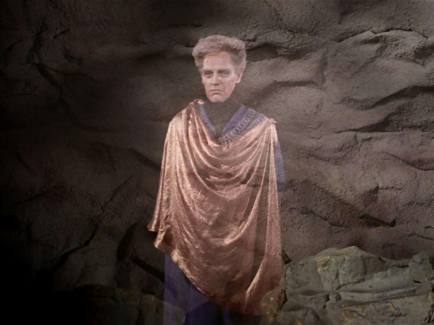 A projection of Landru appears before the crew of the Enterpise in 'The Return of the Archons'