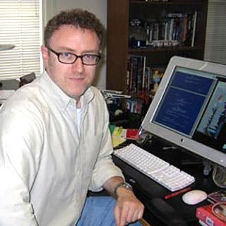 Mike Sussman sits at his computer 
