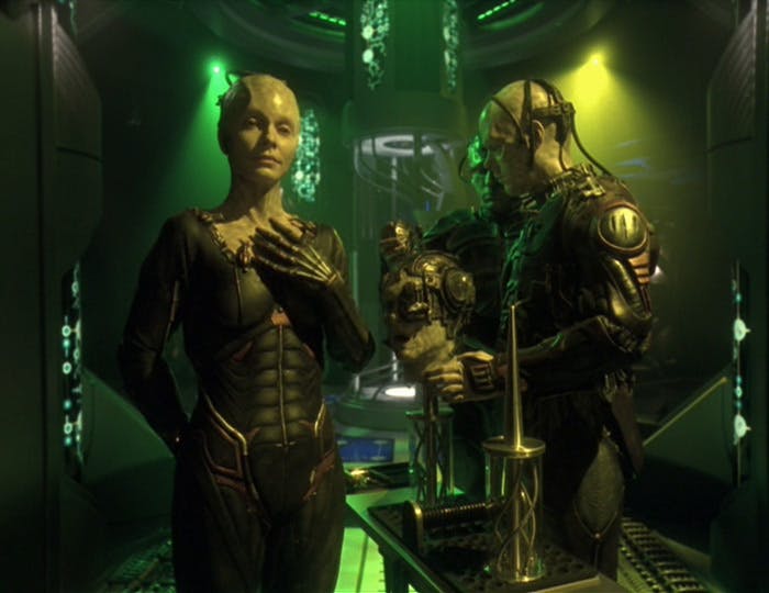 The Borg Queen stands besides her Borg soldiers in 'Unimatrix Zero, Part I'