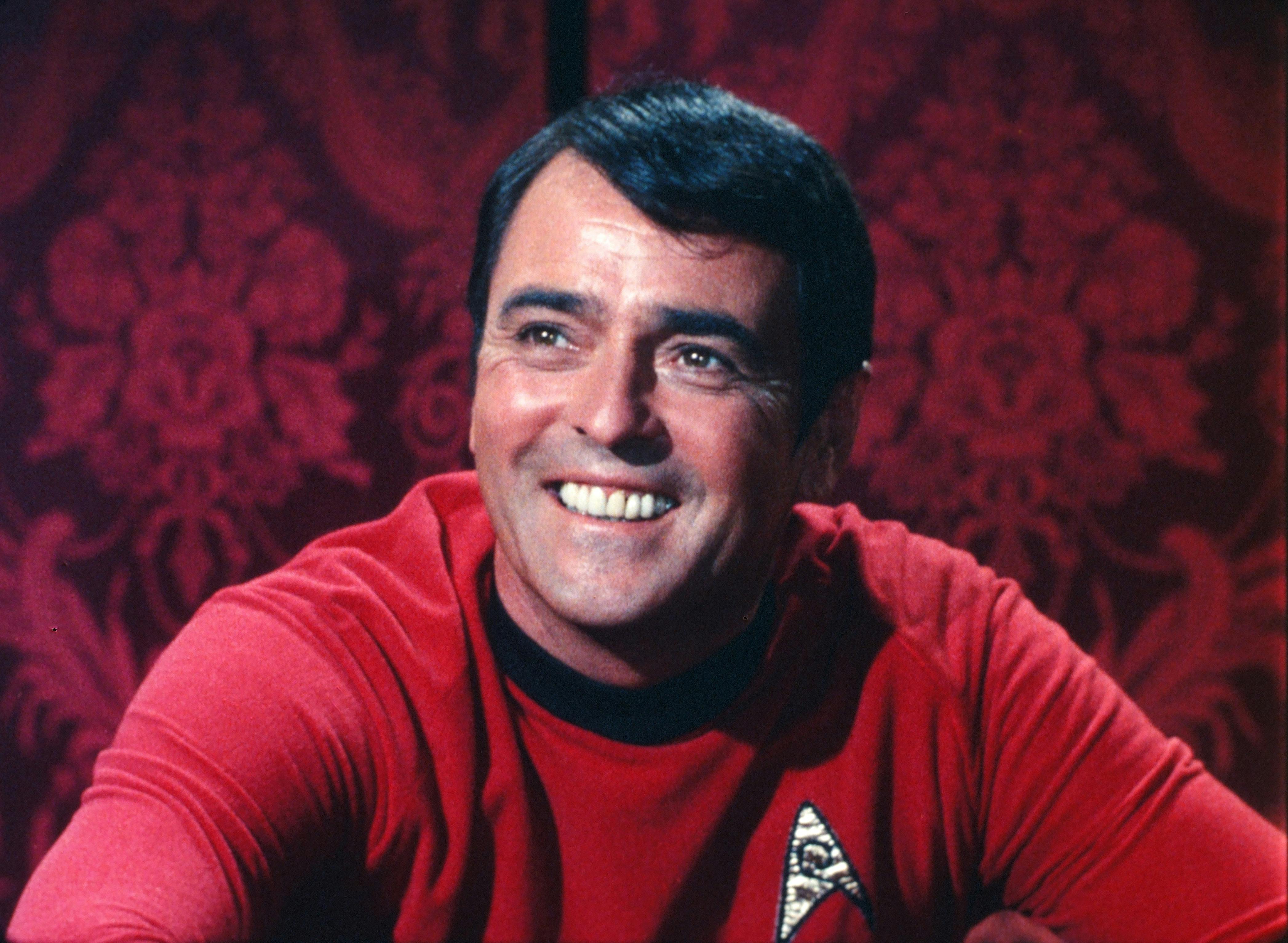 Close-up of a smiling Montgomery Scott in 'Wolf in the Fold'