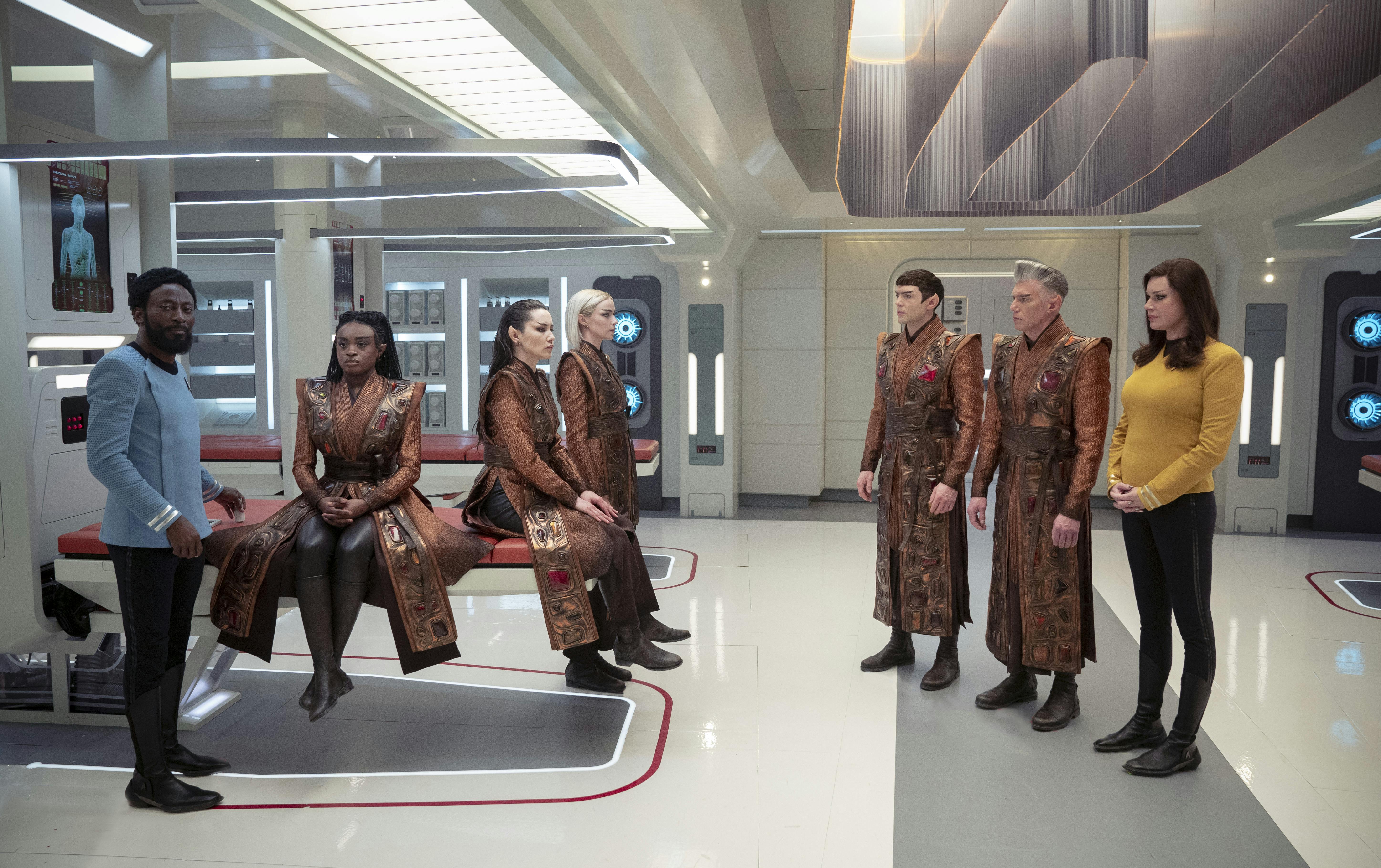 Upon returning from an away mission, Dr. M'Benga, Spock, and Number One are concerned that Uhura, La'An, Chapel, and Pike are unable to return human from their Vulcan state in 'Four-and-a-Half Vulcans'