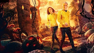 Stylized pulp-style poster that features Una Chin-Riley (Number One) and Captain Pike walking through temple ruins with two visible planets and birds flying in the background sky
