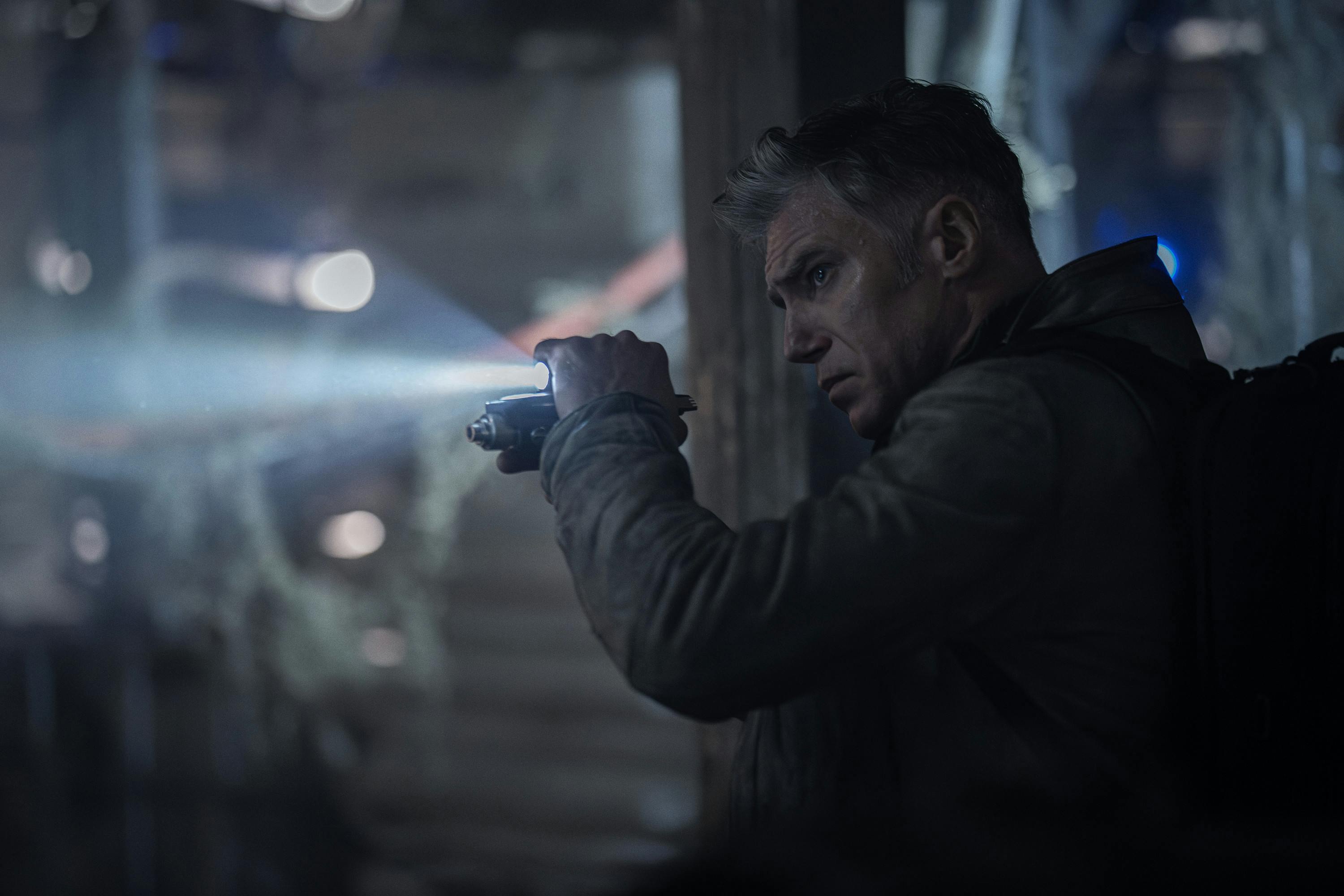 Captain Pike navigates a facility Kenfori with weapon drawn and flashlight shining in 'Shuttle to Kenfori'