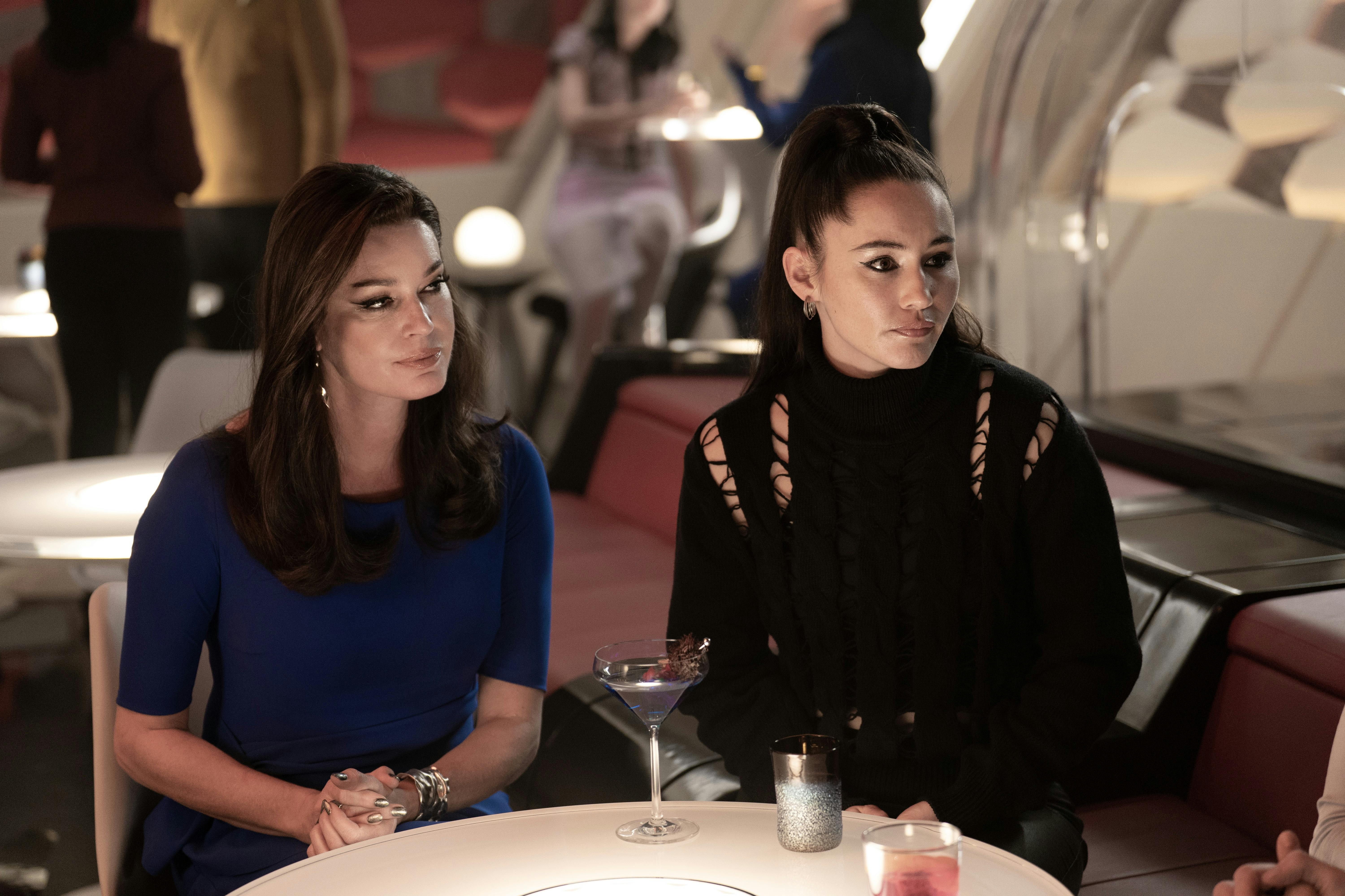 In dressed up civilian attire, Una and La'An sit in the port galley in 'Wedding Bell Blues'