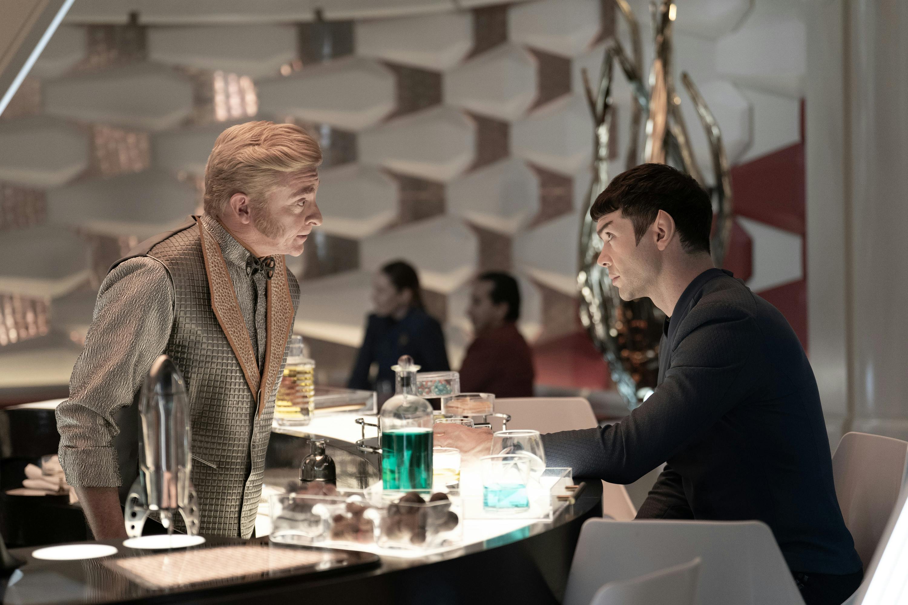 Trelane masquerading as a bartender serves a beverage to Spock in the Port Galley in 'Wedding Bell Blues'