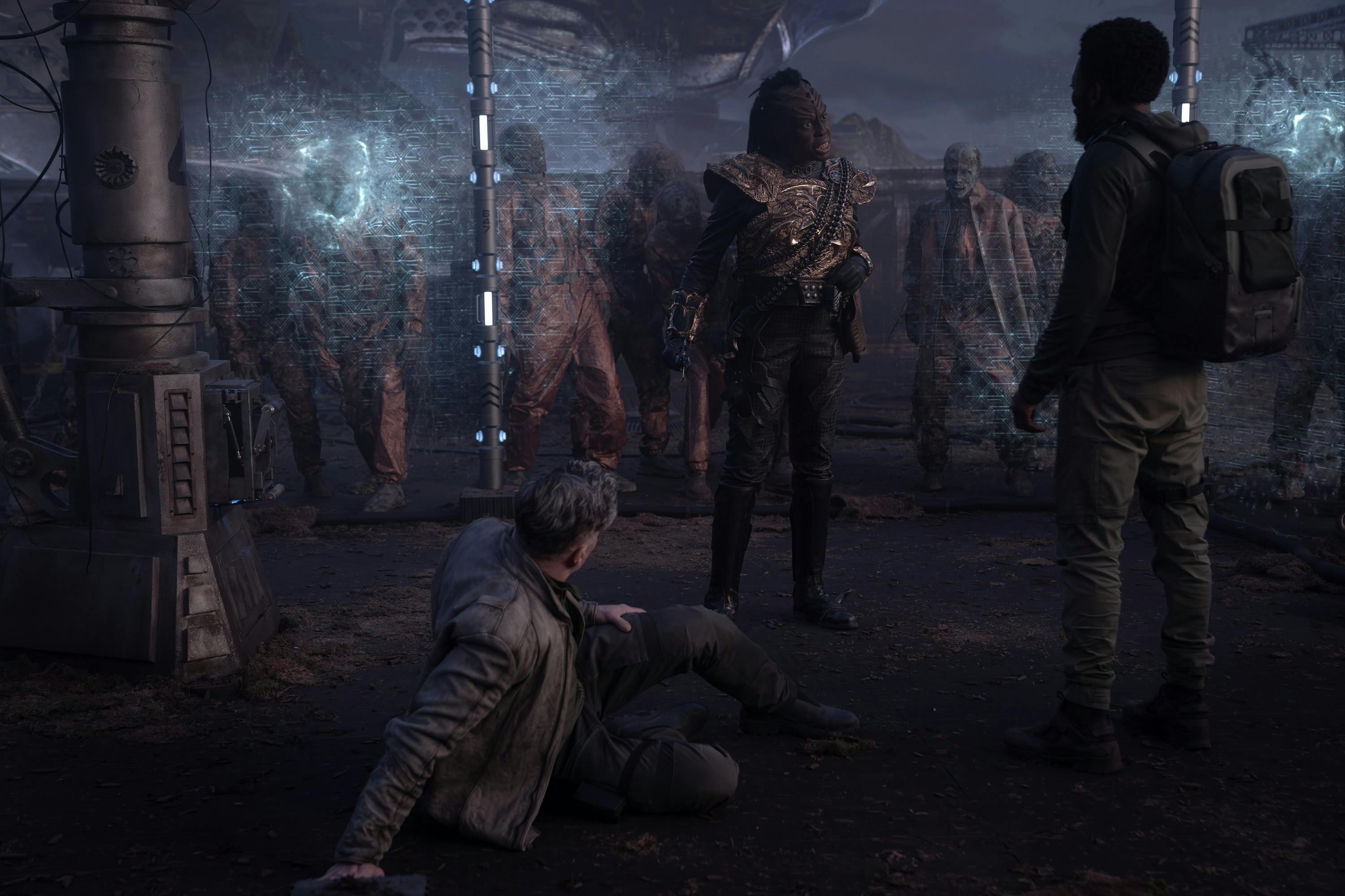 With zombies behind a force field, Bytha faces M'Benga as an injured Pike lays beside him in 'Shuttle to Kenfori'