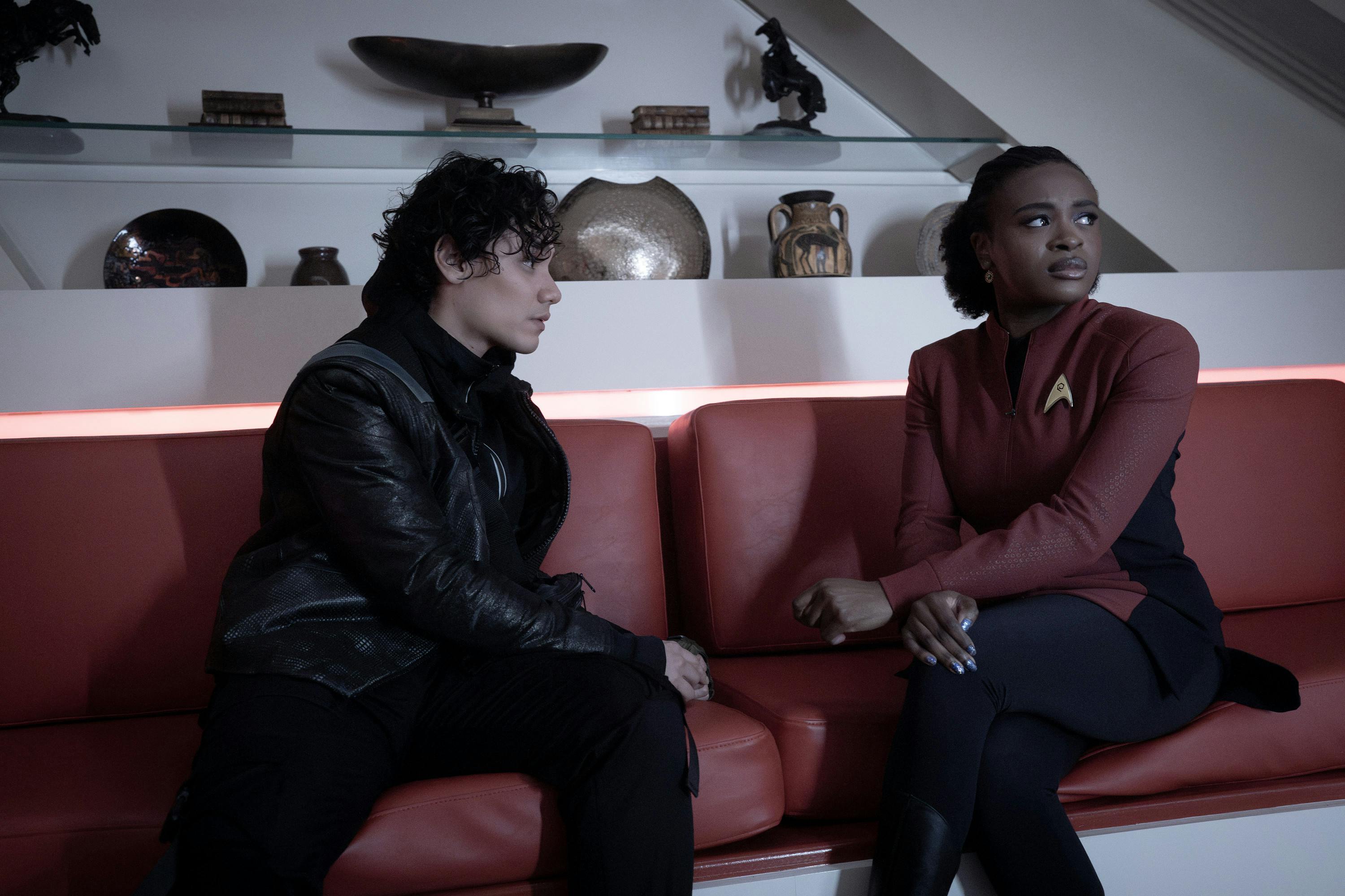 In the Enterprise Ready Room, Beto looks intently at Uhura as she gazes over her shoulder in 'What is Starfleet?'