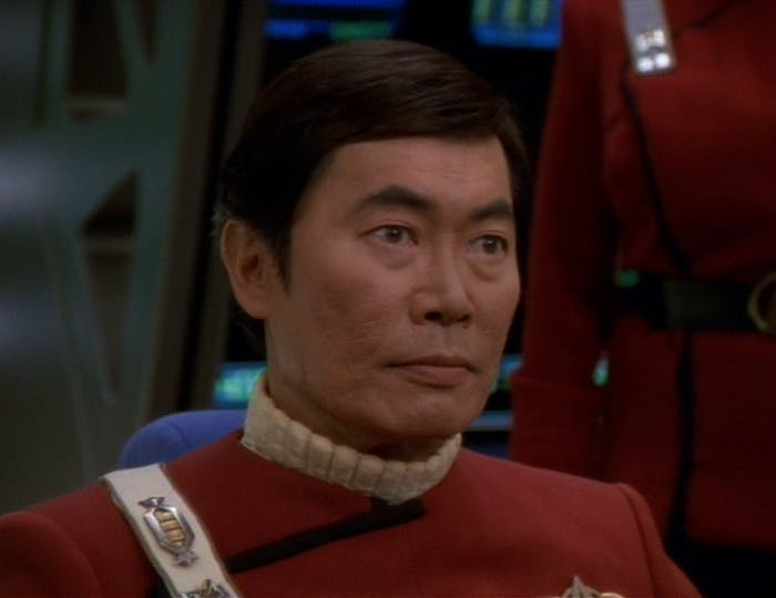 Close-up of Captain Sulu in the command seat on the bridge in 'Flashback'