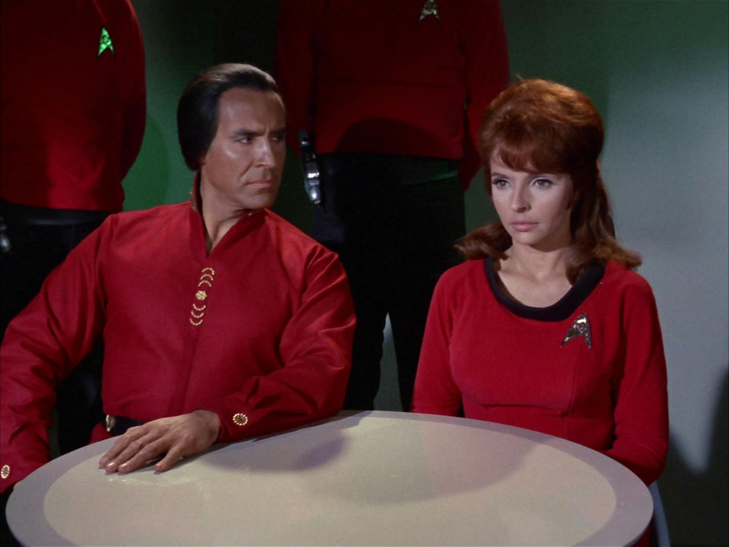 At a formal hearing on the Enterprise, Khan Noonien Singh sits side by side with Marla McGivers in 'Space Seed'
