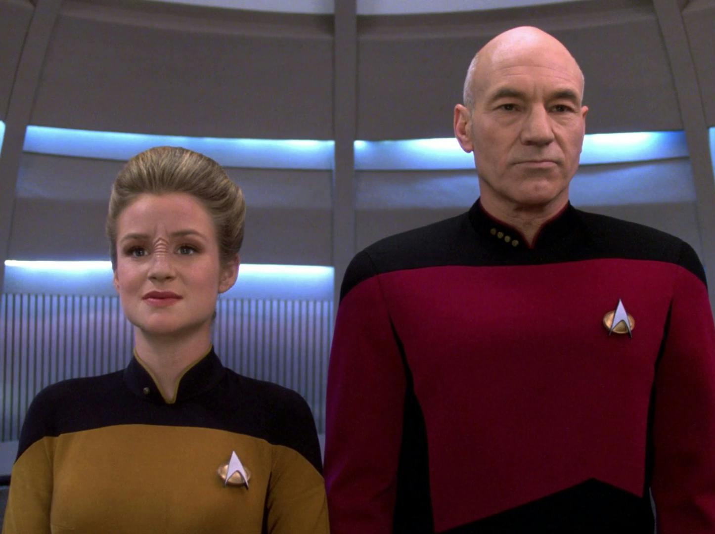 In the turbolift, Ensign Jito Saxa stands side by side with Captain Jean-Luc Picard as they both look forward in 'Lower Decks'