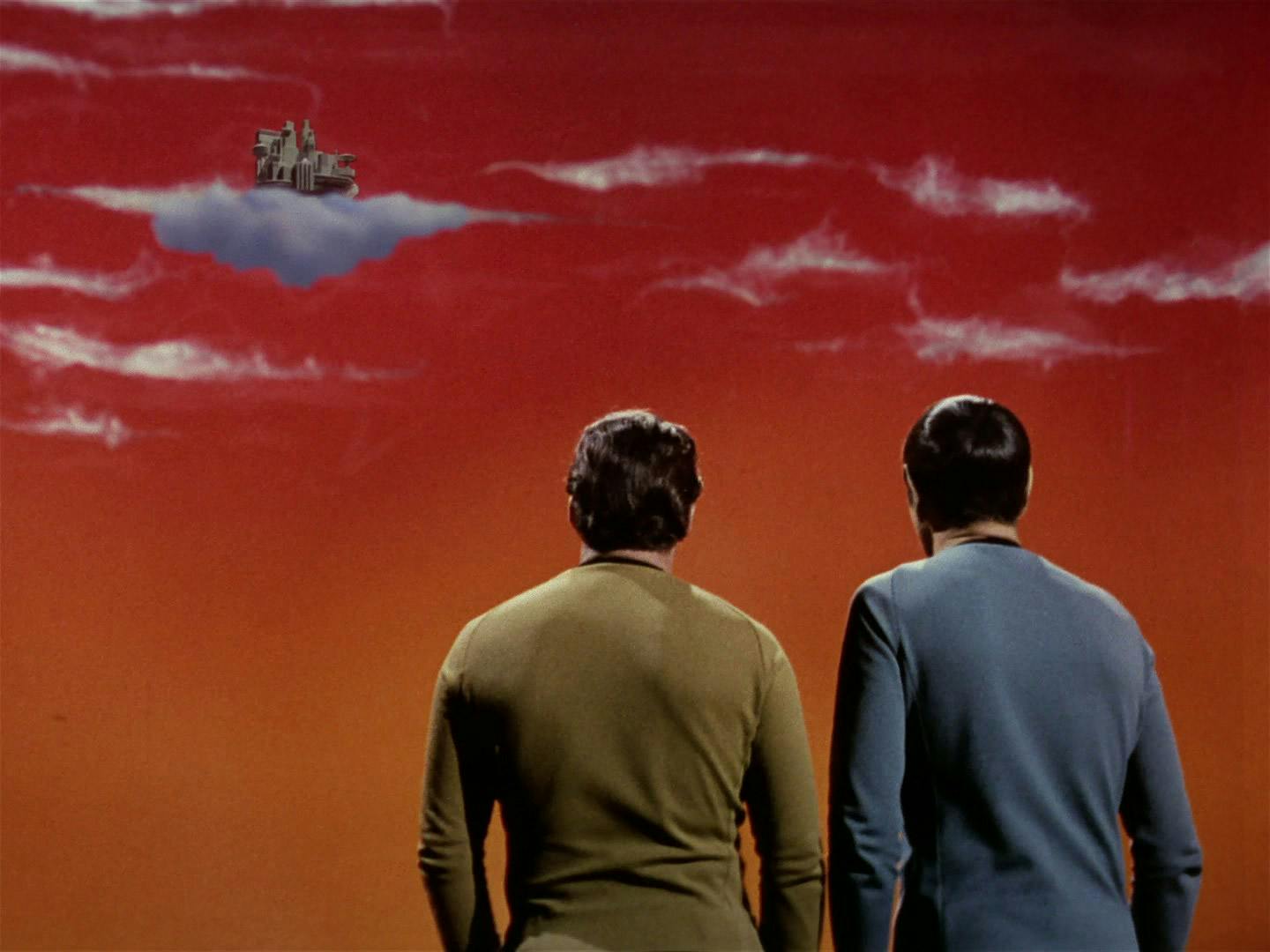 On the surface of Ardana, Kirk and Spock look up at the cloud city of Stratos in the sky in 'The Cloud Minders'