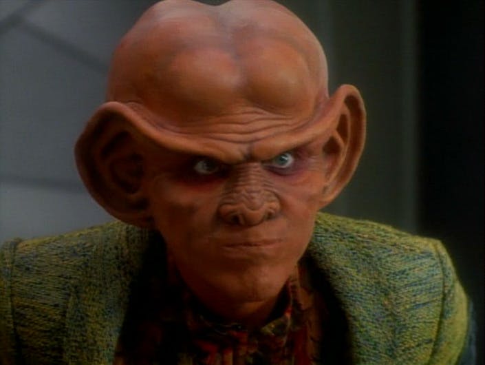 Close-up of a stern Quark in 'The Maquis, Part II'
