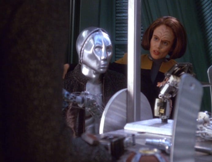 In the lab, B'Elanna looks over at a humanoid android 3947 as they construct another android for it in 'Prototype'