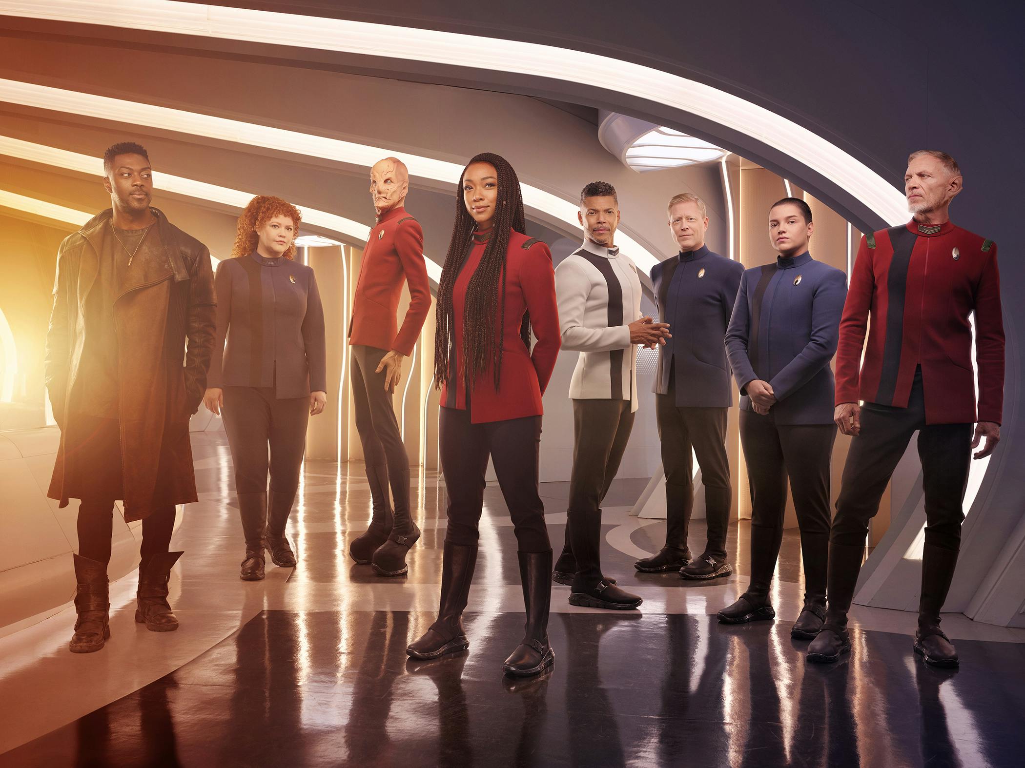 Star Trek: Discovery cast photo featuring Cleveland Booker, Sylvia Tilly, Saru, Michael Burnham, Hugh Culber, Paul Stamets, Adira, and Rayner
