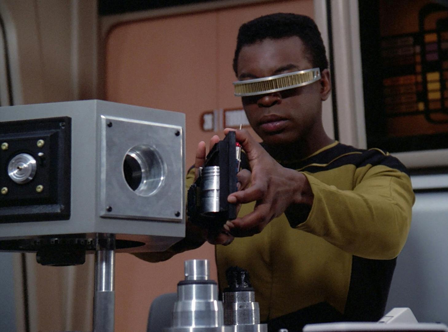 In Engineering, Geordi La Forge inspects the damage to Thadiun Okona's guidance system in 'The Outrageous Okona'
