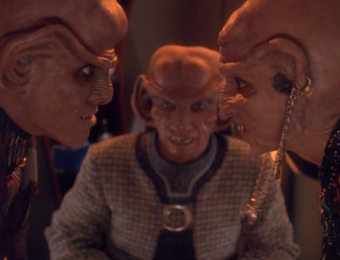 Stuck in the middle, Rom observes as Quark and their Moogie (mom) Ishka face off in 'Family Business'