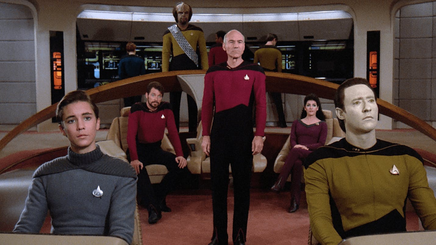 Header image for Star Trek: The Next Generation showing Jean-Luc Picard and crew members on the bridge of the U.S.S. Enterprise