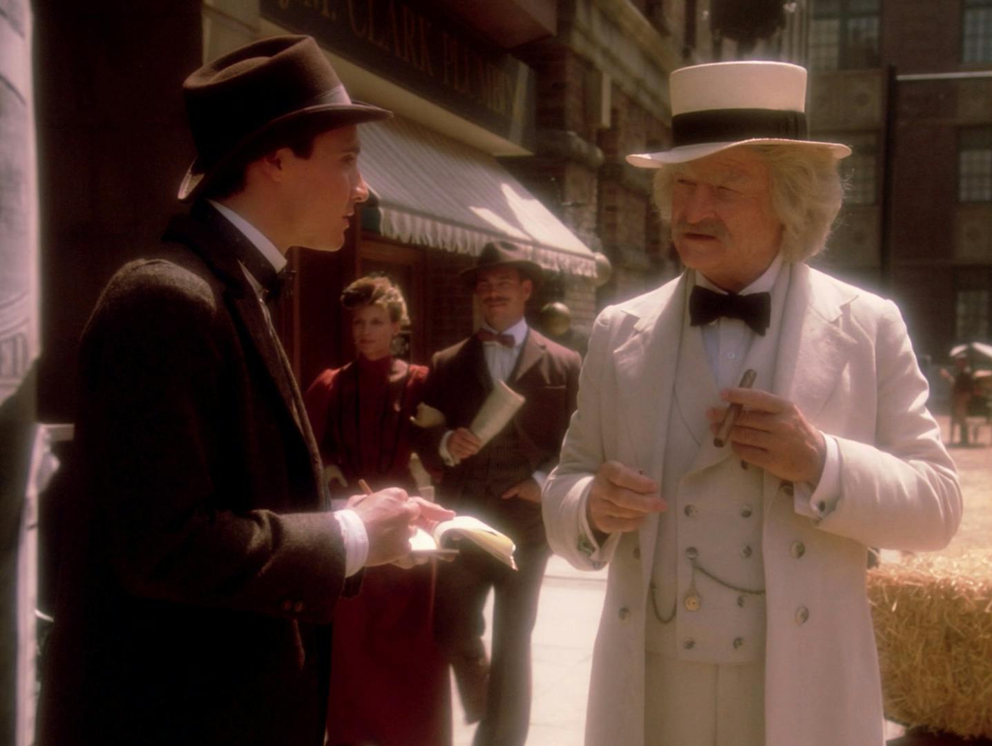 In 1893, Samuel Clemens aka Mark Twain is walking down a street in San Francisco, California with a young reporter in tow writing down much of what he's saying on a notepad while he discusses time travel in 'Time's Arrow, Part II'