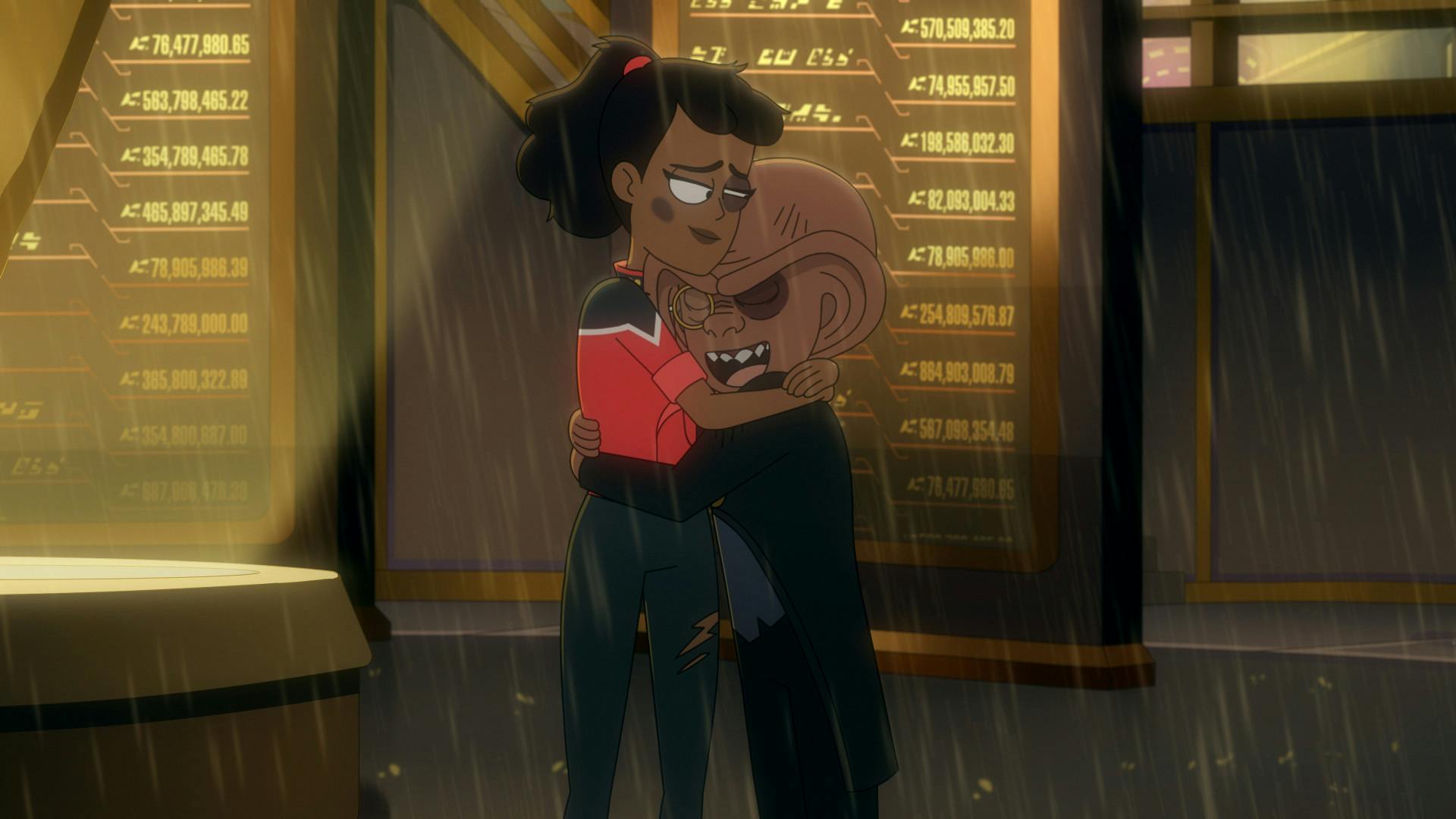 A severely beaten Mariner and Quimp, both sporting black eyes, hug in the rain in front of the Ferengi Dominion War Memorial in 'Parth Ferengi's Heart Place'