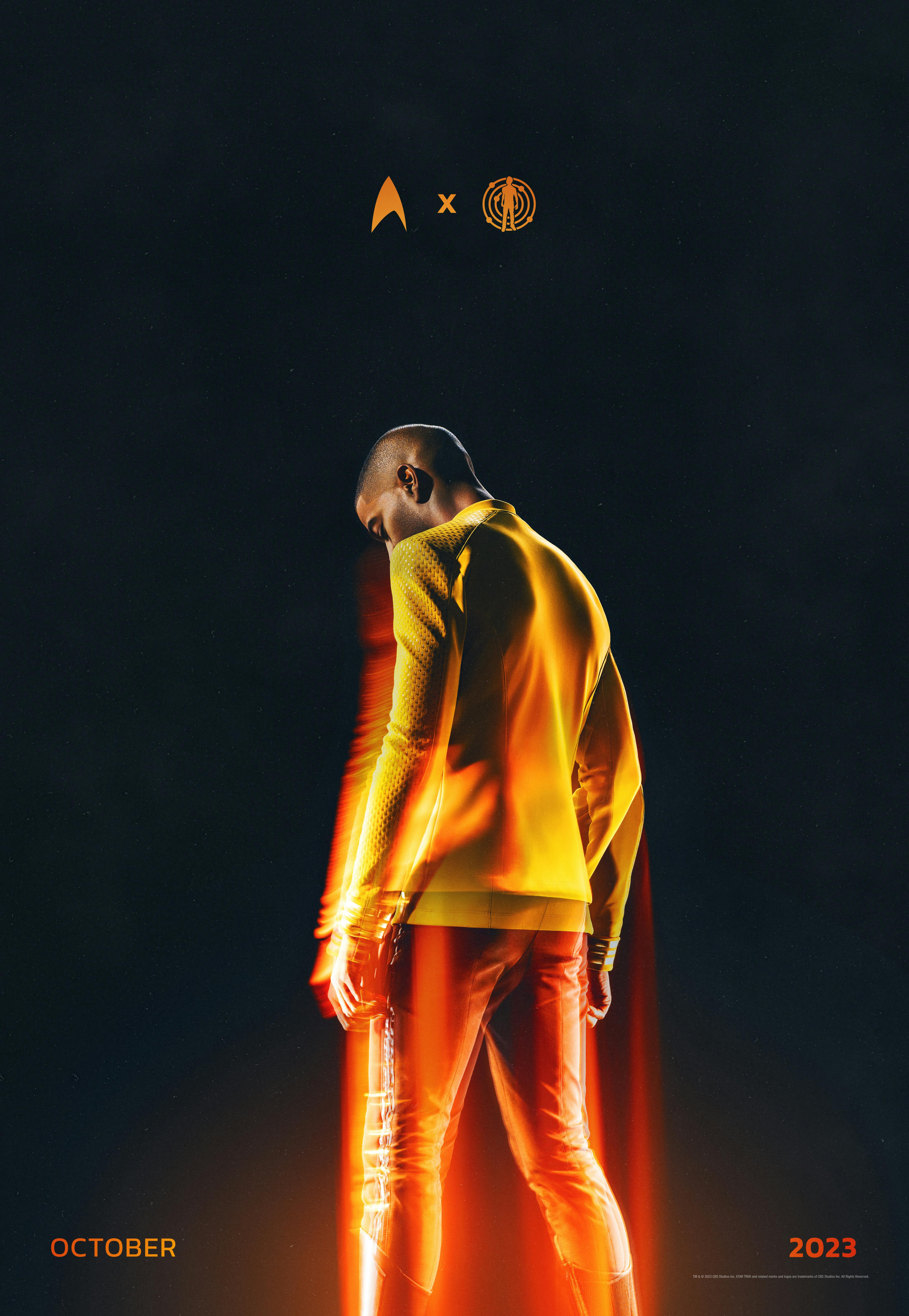 Stylistic teaser art of Kid Cudi wearing his Starfleet captain's uniform with his back turned and lit with a transporter glow