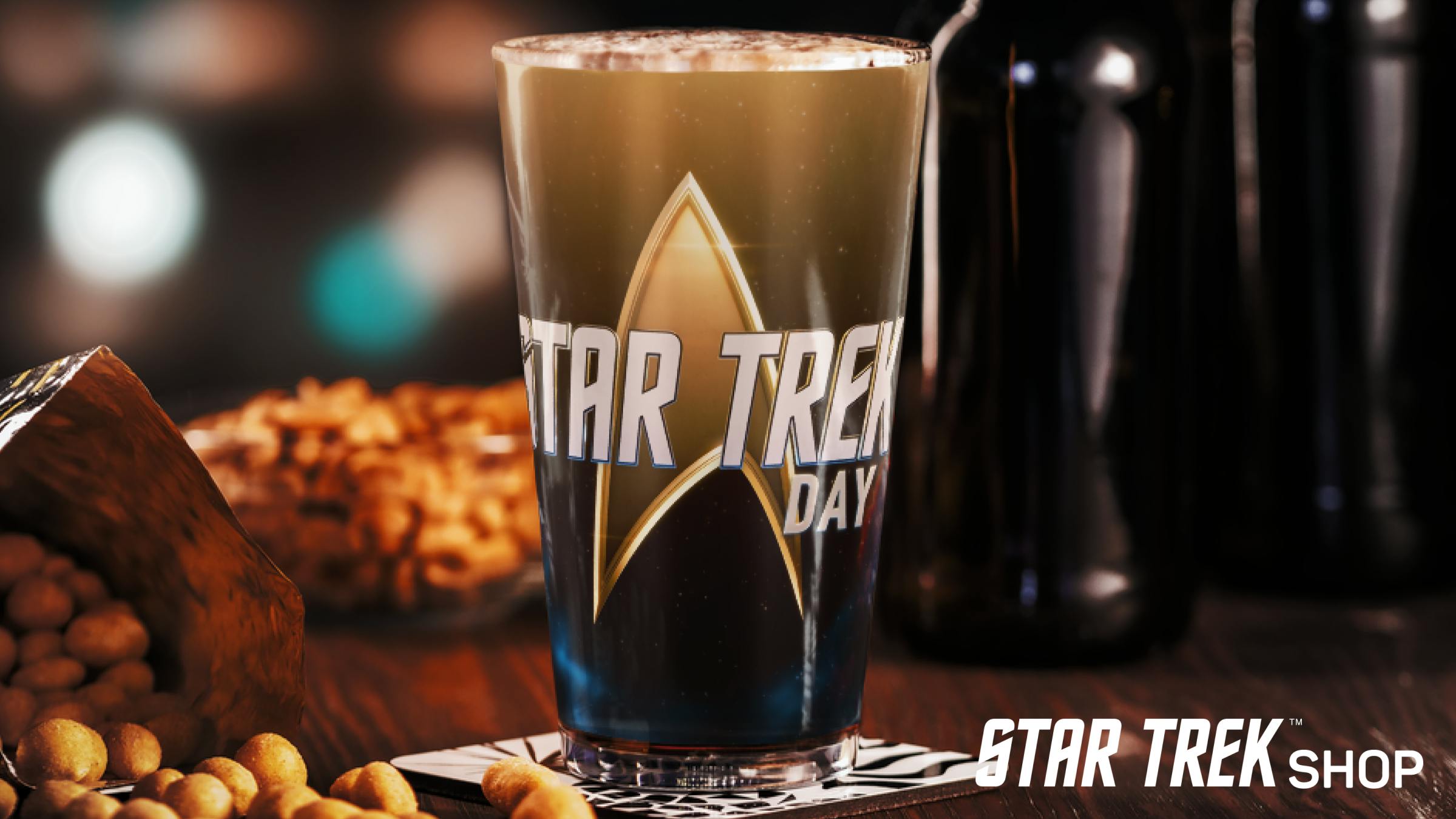 Star Trek Day glassware next to snacks on a table from the Star Trek Shop