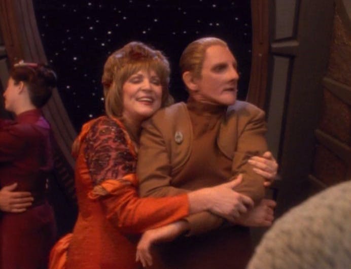 Lwaxana Troi forces a deep embrace on an unwilling Odo in 'Fascination' 