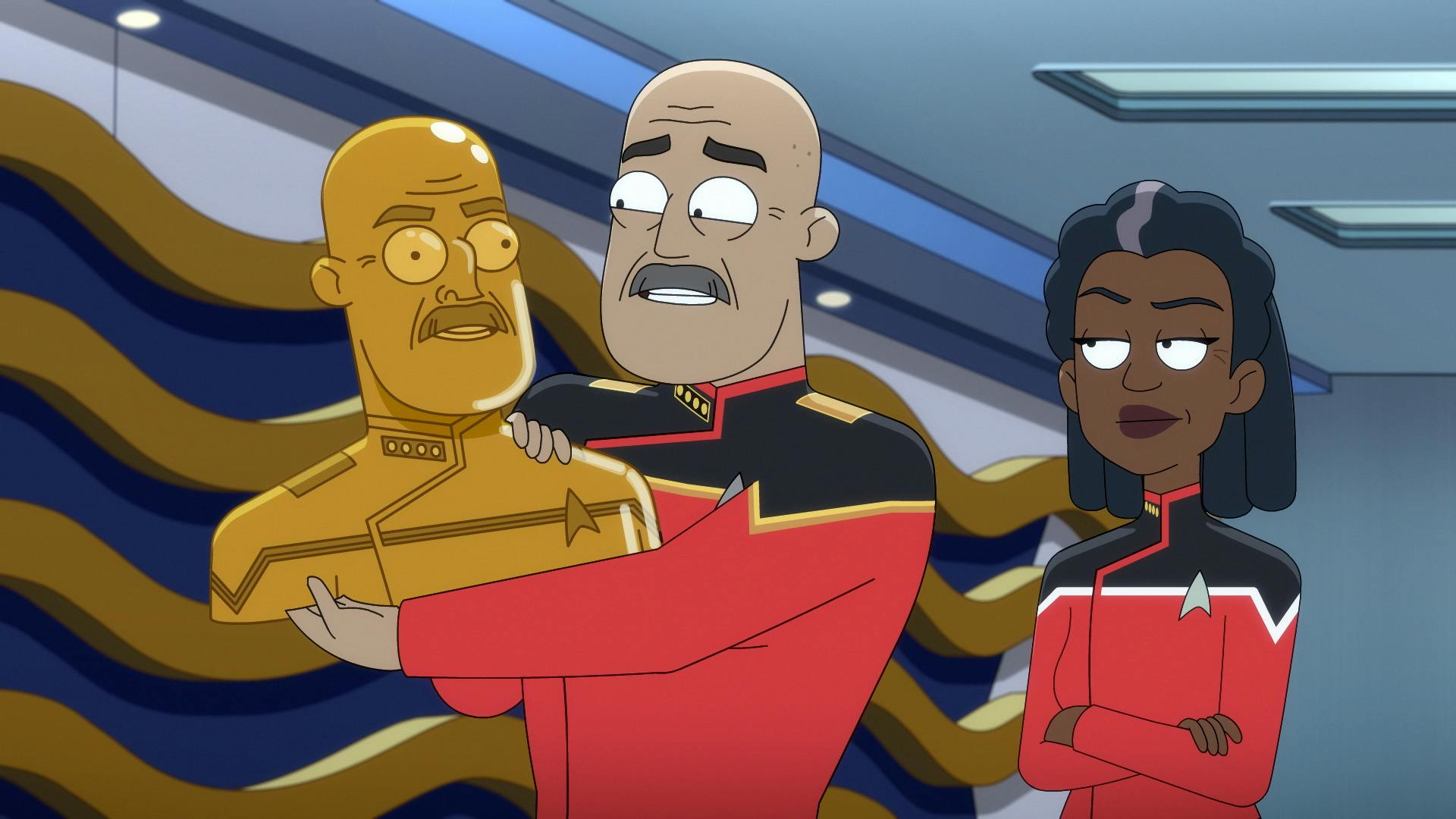 Aboard the U.S.S. Toronto's conference room, Admiral Vassery lifts up a gifted golden bust of himself as Captain Freeman stands beside him in 'Parth Ferengi's Heart Place'
