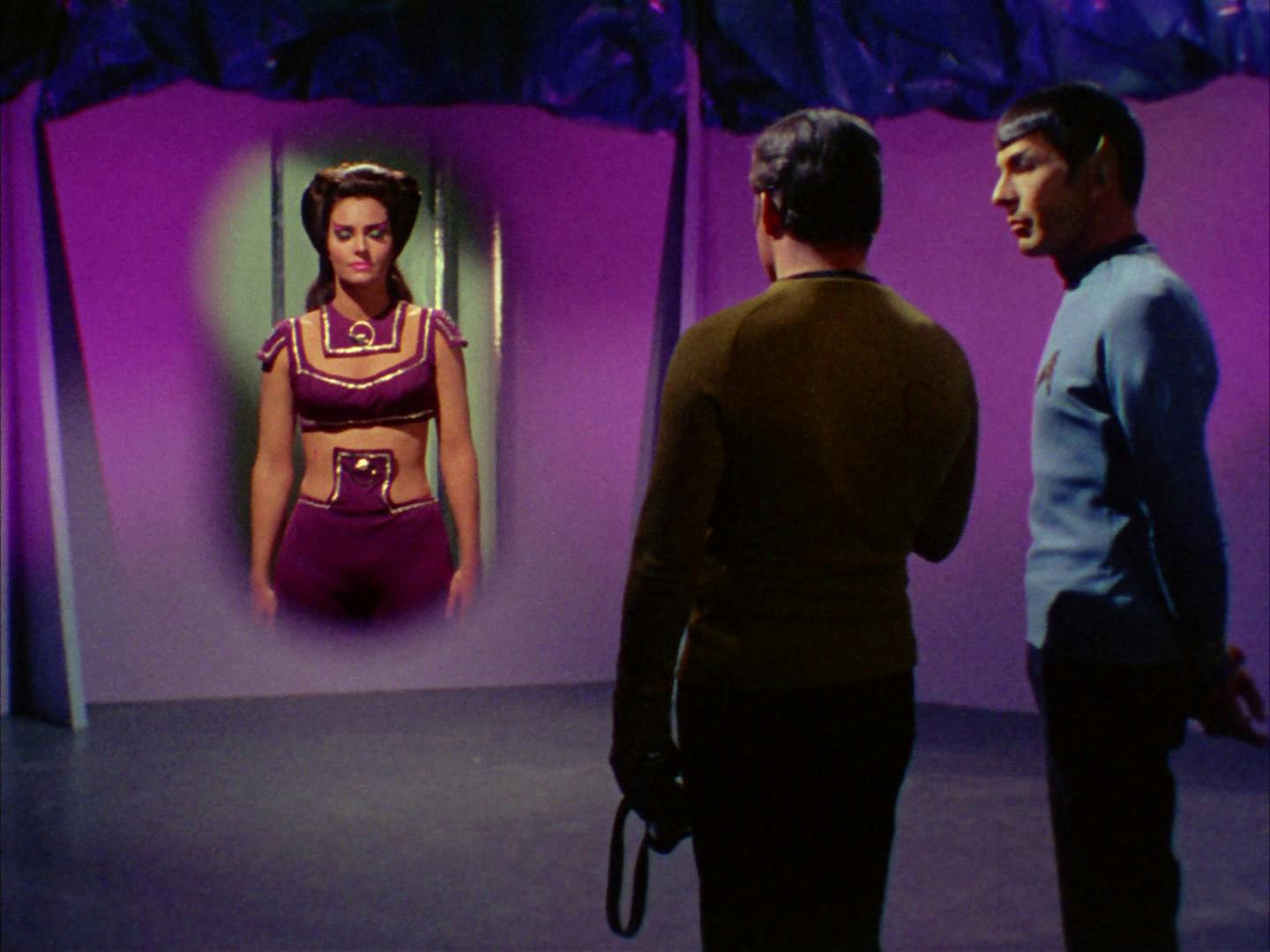 Kirk and Spock look at a projected computer rendering of Losira in 'That Which Survives'