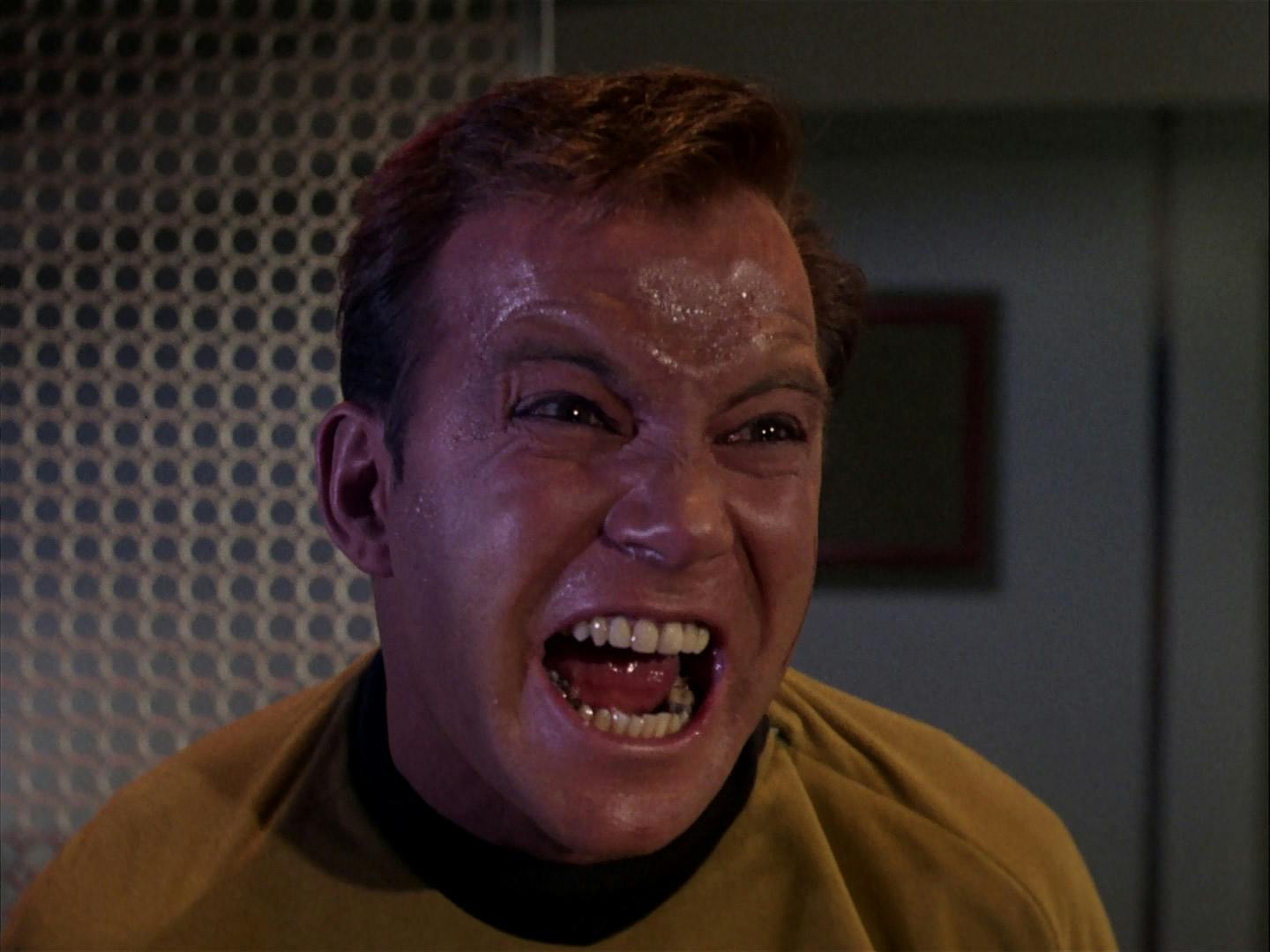 A sweaty Kirk, bearing his teeth, screams in 'The Enemy Within'