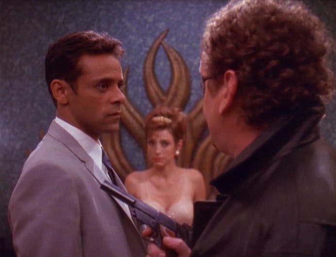 In a holoprogram, O'Brien with an eyepatch approaches holding a gun to Bashir as Kira lays in bed in 'Our Man Bashir'