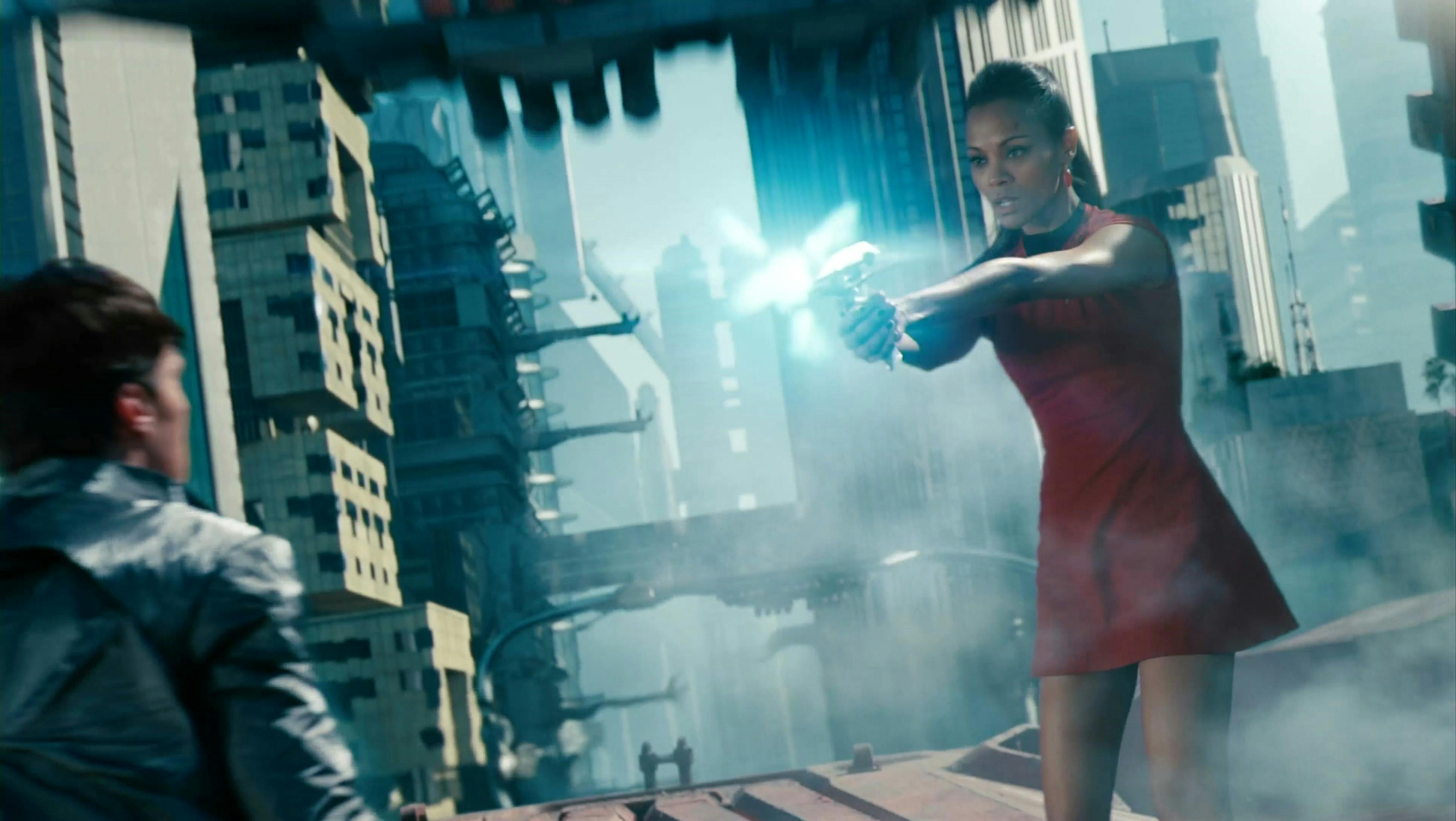 On the roof of a moving train, Uhura fires her phaser at Khan as he brawled with Spock in Star Trek Into Darkness