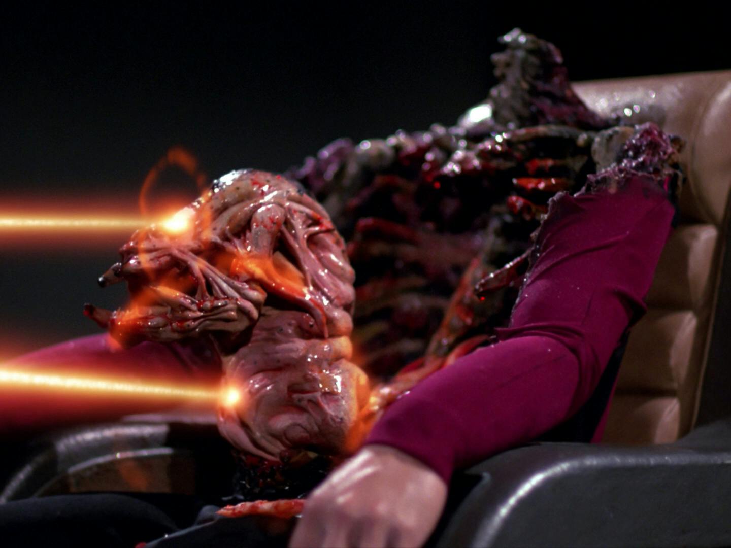 Parasitic aliens infiltrate Starfleet with the mother parasite dissolving an officer's chest cavity, lurching out screaming at Riker and Picard in 'Conspiracy'