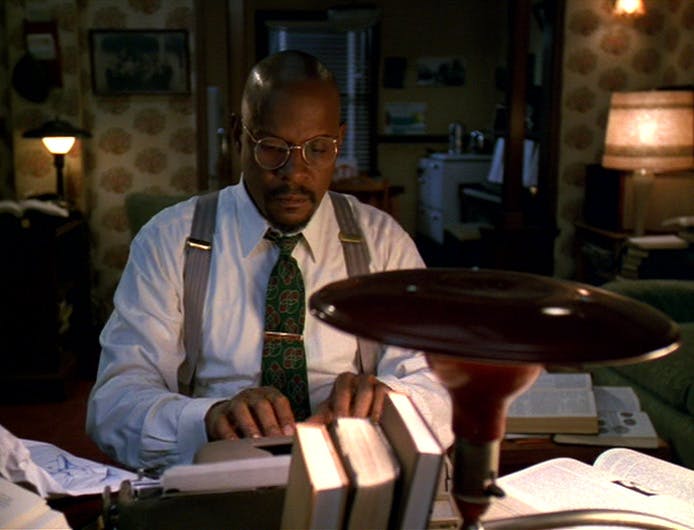 Benny Russell (Ben Sisko) sits at his typewriter in his home office typing a story in 'Far Beyond the Stars'